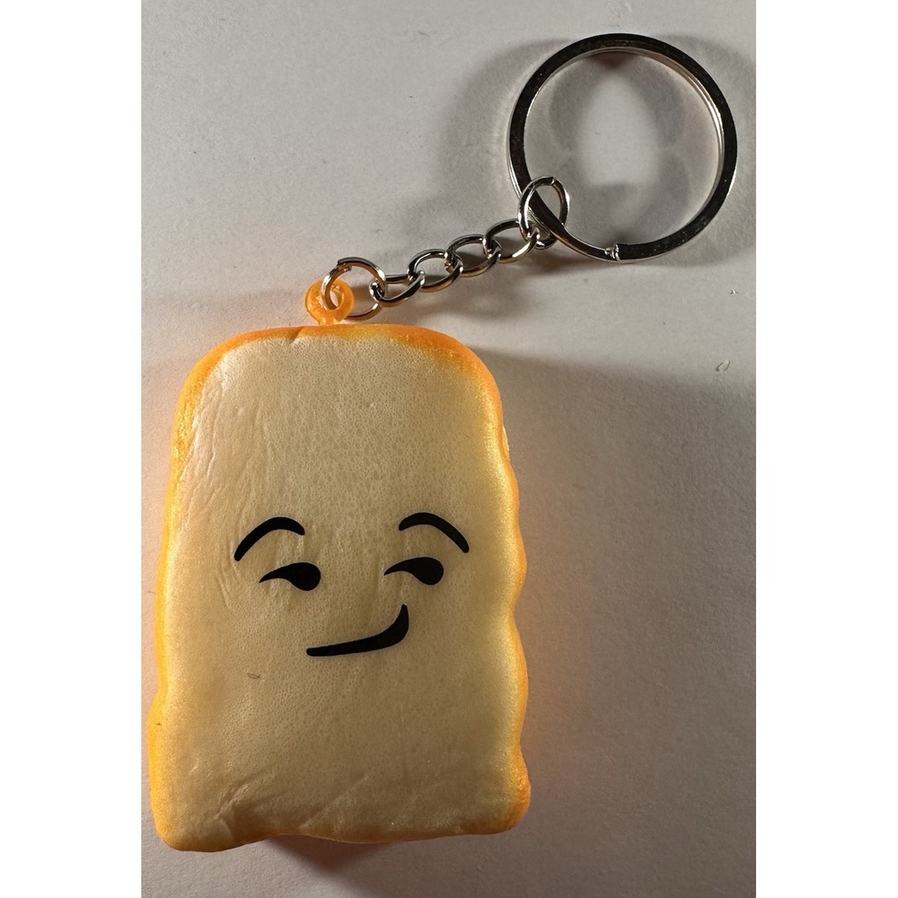 Cute Slice of toast keychain featuring playful smug facial expression